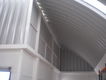19. Arcotecho desplantado en terreno de geometría irregular.